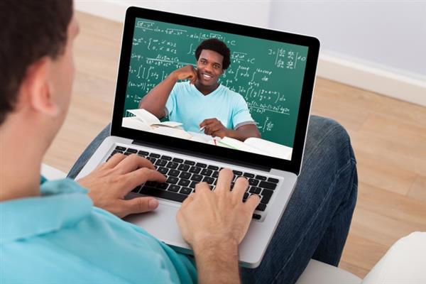 Boy typing on laptop